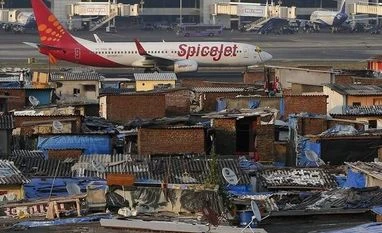 AAI defends safety standards of ATC; says comparable to best globally A SpiceJet passenger aircraft taxis on the runway at the airport next to a slum area in Mumbai