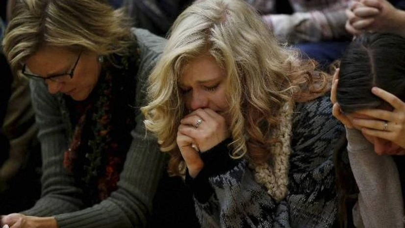 People attend a vigil on the campus of the University of Colorado, Colorado Springs for the victims of a deadly shooting at a Planned Parenthood clinic. Photo: PTI People attend a vigil on the campus of the University of Colorado, Colorado Springs for the victims of a deadly shooting at a Planned Parenthood clinic. Photo: PTI