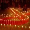 A girl  light candles during an AIDS awareness campaign. Photo: PTI