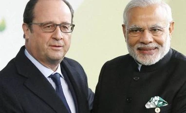 French Army to be first foreign contingent to participate in Republic Day Parade French President Francois Hollande greets Prime Minister Narendra Modi as he arrives for the COP21, United Nations Climate Change Conference. Photo: PTI