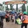 Rescuers shift patients from a flooded hospital after heavy rains in Chennai on Tuesday