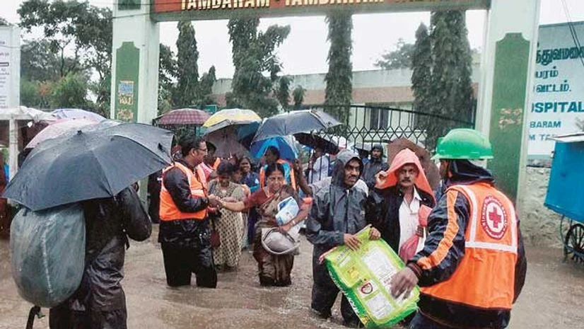 Rescuers shift patients from a flooded hospital after heavy rains in Chennai on Tuesday Rescuers shift patients from a flooded hospital after heavy rains in Chennai on Tuesday