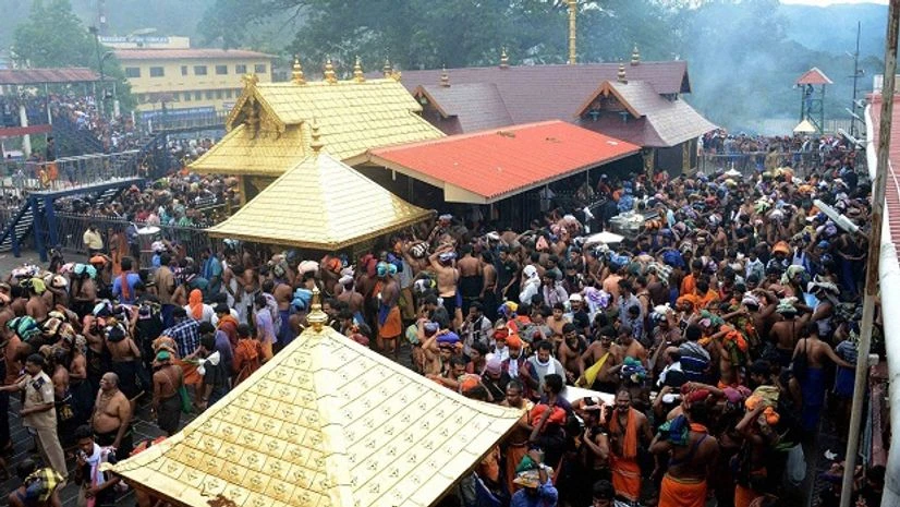 Devotees throng to witness Lord Ayyappa at Sannidanam in Sabarimala, Kerala. (Photo: PTI) Devotees throng to witness Lord Ayyappa at Sannidanam in Sabarimala, Kerala. (Photo: PTI)