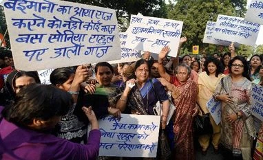 Passage of GST Bill runs into fresh roadblocks Members of IYC, NSUI and Mahila Congress protest against the central government regarding National Herald Case at Teen Murti in New Delhi