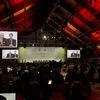 French Foreign affairs minister and acting president of the COP21, Laurent Fabius is seen on giant screens during the 'Committee of Paris' plenary work session at the COP21, United Nations Climate Change Conference in Le Bourget, north of Paris, Fran