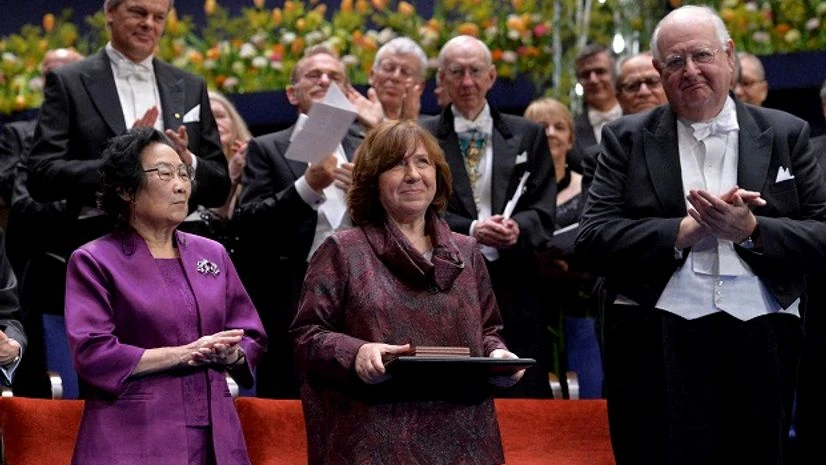 The 2015 Nobel literature laureate Svetlana Alexievich of Belarus (center) is applauded by fellow laureates Tu Youyou (left) and Angus Deaton (right) during the 2015 Nobel prize award ceremony in Stockholm on Thursday. Photo: PTI The 2015 Nobel literature laureate Svetlana Alexievich of Belarus (center) is applauded by fellow laureates Tu Youyou (left) and Angus Deaton (right) during the 2015 Nobel prize award ceremony in Stockholm on Thursday. Photo: PTI