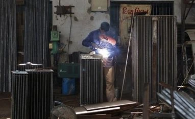 Govt imposes anti-dumping duty on cold-rolled steel products A worker wields a commercial heater in Ahmedabad