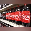 Bottles of Coca Cola are seen in a store display in New York Bottles of Coca Cola are seen in a store display in New York