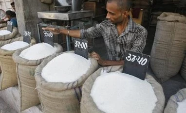 Sugar output up 4% this season despite lower cane availability A vendor arranges price tag over sack filled with sugar at wholesale vegetable market in Ahmedabad
