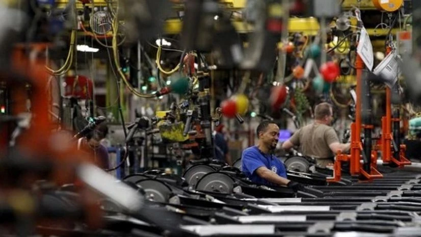 Workers perform assembly on SUV chassis at a car assembly plant in Arlington, Texas Workers perform assembly on SUV chassis at a car assembly plant in Arlington, Texas
