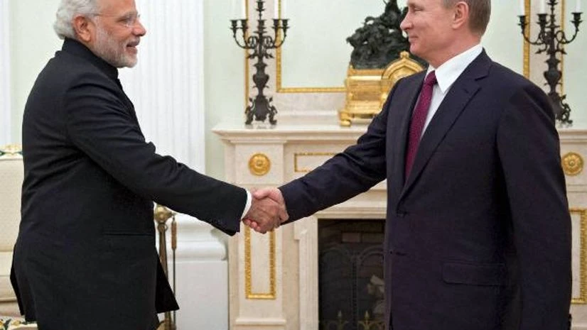 Russian President Vladimir Putin, right, greets Indian Prime Minister Narendra Modi during their meeting in the Kremlin in Moscow. Photo: PTI Russian President Vladimir Putin, right, greets Indian Prime Minister Narendra Modi during their meeting in the Kremlin in Moscow. Photo: PTI