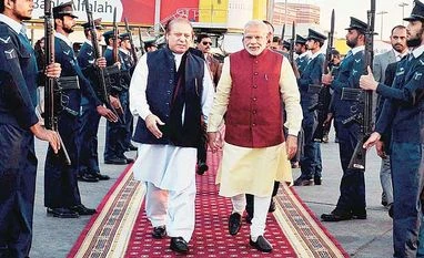 Modi's Pakistan visit 'step in right direction': J&K CM Prime Minister Narendra Modi (right) is received by his Pakistani counterpart, Nawaz Sharif, upon his arrival in Lahore on Friday