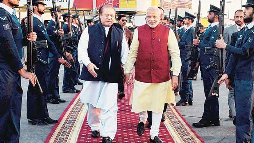 Prime Minister Narendra Modi (right) is received by his Pakistani counterpart, Nawaz Sharif, upon his arrival in Lahore on Friday Prime Minister Narendra Modi (right) is received by his Pakistani counterpart, Nawaz Sharif, upon his arrival in Lahore on Friday