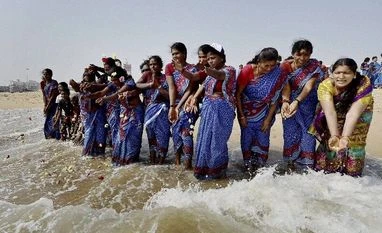 Memorials, processions mark Tsunami 11th anniversary in TN Women pray at Marina beach at the Bay of Bengal to commemorate the 11th anniversary of the 2004 Tsunami, in Chennai