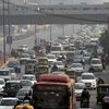 Vehicles plying at a road during the trial of the 'odd-even car scheme' at ITO in New Delhi