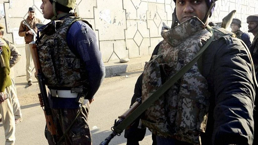 Pathankot: Security forces personnel stand guard at road near the Indian Air Force base that was attacked by militants in Pathankot, Punjab on Saturday. PTI Photo Pathankot: Security forces personnel stand guard at road near the Indian Air Force base that was attacked by militants in Pathankot, Punjab on Saturday. PTI Photo