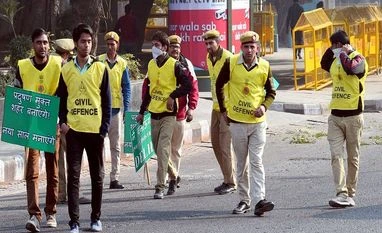 Odd-even: More traffic personnel, volunteers deployed on Day 2 Civil Defence olunteers holding placards at ITO as Odd-even scheme restricting movement of private cars, is operational in New Delhi.
