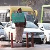 A policeman holding up a placard urging Delhiites to create a pollution-free city. Photo: PTI