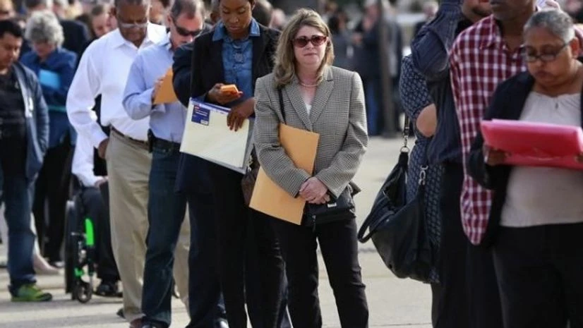 People wait in line to enter the Nassau County Mega Job Fair at Nassau Veterans Memorial Coliseum in Uniondale, New York People wait in line to enter the Nassau County Mega Job Fair at Nassau Veterans Memorial Coliseum in Uniondale, New York