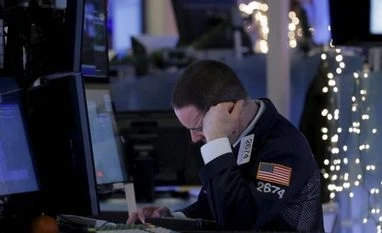 Wall St plunges; Nasdaq at lowest since August A specialist trader works at his post on the floor of the New York Stock Exchange in New York