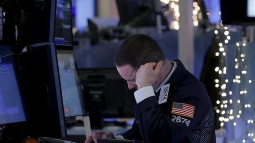 A specialist trader works at his post on the floor of the New York Stock Exchange in New York A specialist trader works at his post on the floor of the New York Stock Exchange in New York