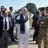 Indian Prime Minister Narendra Modi watching a presentation on counter-terrorist and combing operation by the Defence Forces, at Pathankot Airbase