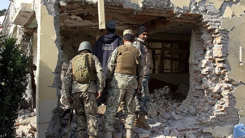 Afghan security forces inspect a building, used by insurgents to launch an attack on Pakistan's consulate in Jalalabad, capital of Nangarhar province, Afghanistan. Afghan security forces inspect a building, used by insurgents to launch an attack on Pakistan's consulate in Jalalabad, capital of Nangarhar province, Afghanistan.