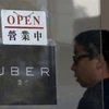 An open sign is seen at the office of taxi-hailing service Uber Inc during a driver recruitment event in Hong Kong