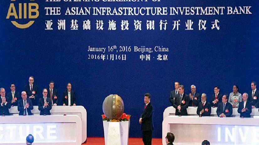Representatives of the founding nations of the Asian Infrastructure Investment Bank (AIIB) applaud as Chinese President Xi Jinping, center, unveils a sculpture during the opening ceremony of the AIIB in Beijing. Representatives of the founding nations of the Asian Infrastructure Investment Bank (AIIB) applaud as Chinese President Xi Jinping, center, unveils a sculpture during the opening ceremony of the AIIB in Beijing.