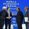 IMF chief Christine Lagarde, left, Britain's Chancellor of the Exchequer George Osborne, 2nd left, Indian Finance Minister Arun Jaitley, 2nd right, and Governor of the Bank of Japan Haruhiko Kuroda, talk at the WEF in Davos, Switzerland