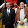 Prime Minister Narendra Modi and French President Francois Hollande with a group of folk dancers in  Chandigarh on January 24, 2016.