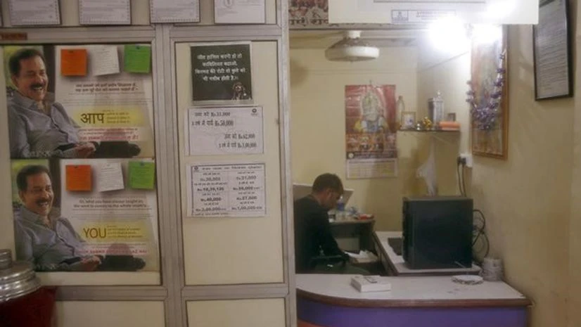 An agent who collects money from investors on behalf of Sahara works inside his small office in Mumbai. Photo: Reuters An agent who collects money from investors on behalf of Sahara works inside his small office in Mumbai. Photo: Reuters
