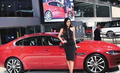 Celebrities add to the shine of the mean machines Katrina Kaif with a Jaguar XE at Auto Expo 2016 in Greater Noida on Wednesday
