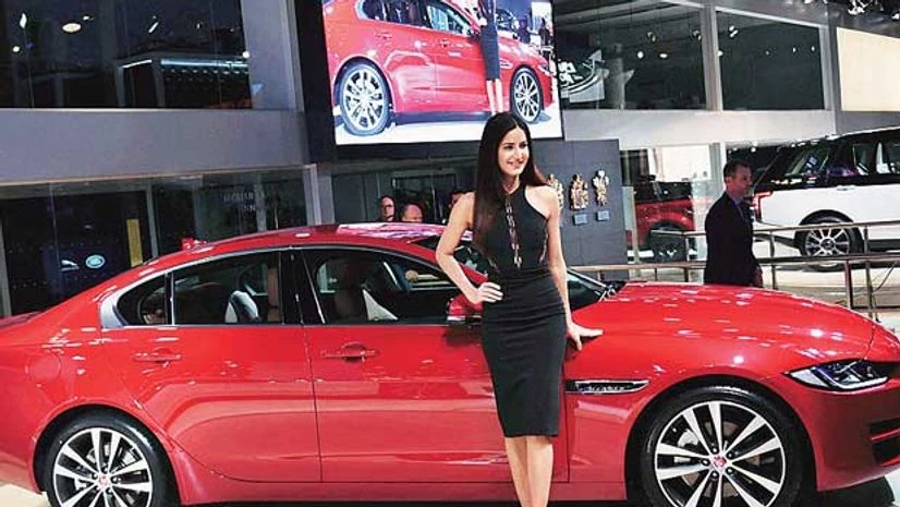Katrina Kaif with a Jaguar XE at Auto Expo 2016 in Greater Noida on Wednesday Katrina Kaif with a Jaguar XE at Auto Expo 2016 in Greater Noida on Wednesday