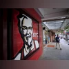 A customer walks out of a KFC restaurant in Shanghai. Photo: Reuters A customer walks out of a KFC restaurant in Shanghai. Photo: Reuters