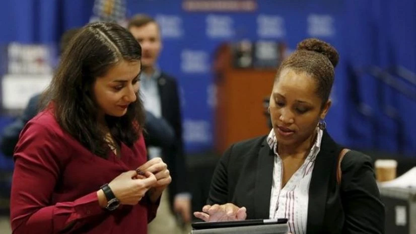 A job applicant (L) has her resume looked at during a U.S. Chamber of Commerce Foundation "Hiring Our Heroes" military job fair in Washington A job applicant (L) has her resume looked at during a U.S. Chamber of Commerce Foundation "Hiring Our Heroes" military job fair in Washington