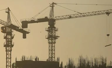 Developers agree with HDFC Chairman Deepak Parekh; PEs say they are best suited Labourers works at the construction site of a residential building in Mumbai. Photo: Reuters