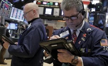 Cautious Yellen drives world stocks near 2016 peaks Traders work on the floor of the New York Stock Exchange (NYSE)