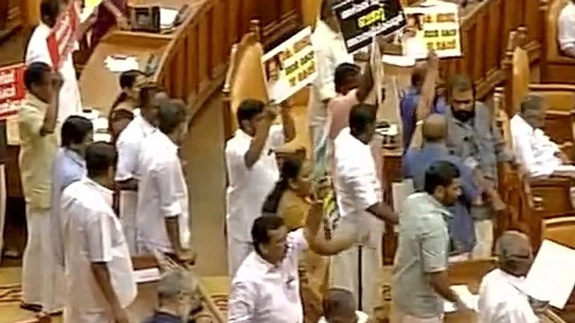 Opposition protests in Kerala Assembly as Kerala CM Oommen Chandy presented the interim budget. Photo: ANI Kerala Assembly