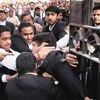A lawyer, who spoke to the media supporting student leader Kanhaiya Kumar, is beaten up by other lawyers outside Patiala House Courts in New Delhi on Wednesday.