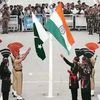 Pakistani rangers and Indian Border Security Force officers during a parade at the check post at the Wagah border