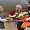 PM Narendra Modi being received at Raipur airport on Sunday, Feb 21, 2016 PTI