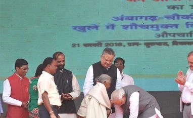 PM 'touched' with 104-year-old woman's Swacch mission gesture Prime Minister Narendra Modi touches the feet of Kuwarbai