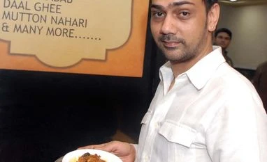 Rashid Hakim with the Chciken Sanju Baba dish Rashid Hakim with the Chciken Sanju Baba dish