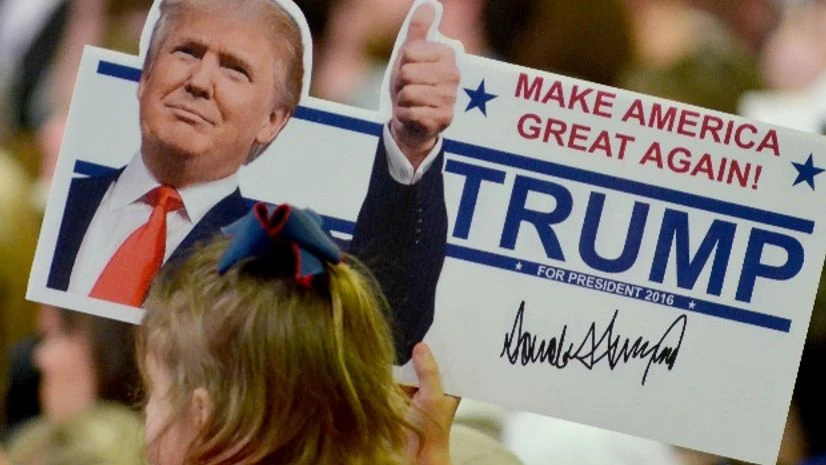 A young supporter holds up a campaign sign for U.S. Republican Presidential candidate Donald Trump at Madison Central High School during at a campaign rally in Madison, Mississippi A young supporter holds up a campaign sign for U.S. Republican Presidential candidate Donald Trump at Madison Central High School during at a campaign rally in Madison, Mississippi