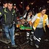 People carry an injured person after an explosion in the busy centre of Turkish capital, Ankara, Turkey. The explosion is believed to have been caused by a car bomb that went off close to bus stops.