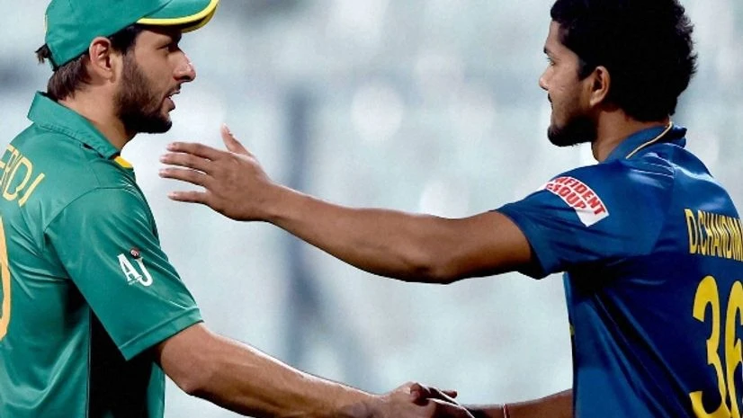 Shahid Afridi Pakistan's cricket team's Shahid Afridi shaking hands with Sri Lanka's Dinesh Chandimal during a warm up match at Eden Garden Photo courtesy: PTI