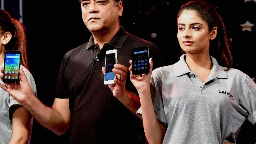 Lenovo Vibe K5 Director-Smartphone Lenovo India, Sudhin Mathur with models at the launch of K5 Plus Smartphones Photo courtesy: PTI