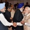 Prime Minister Narendra Modi and former PM Manmohan Singh shake hands at a farewell function for the retired and retiring Members of Rajya Sabha (2016) at Parliament Library Building in New Delhi
