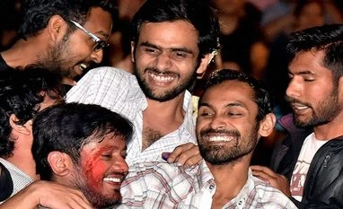 JNUSU protest today, terms action against Kanhaiya, Khalid & Anirban 'unacceptable' JNUSU President Kanhaiya Kumar with Umar Khalid and Anirban Bhattacharya celebrates later's release at JNU Campus after Delhi's Patiala House Court on Friday granted six-month interim bail to Anirban and Umar, slapped with sedition charges